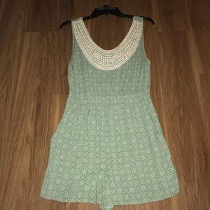 Soft silky green romper.